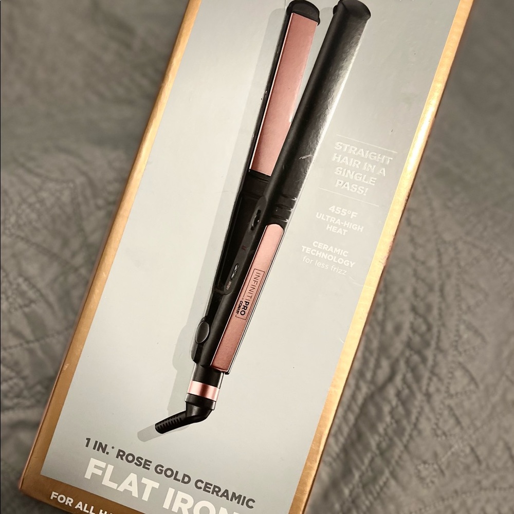Brand new. Conair Infiniti Pro Ceramic straightener/curler.